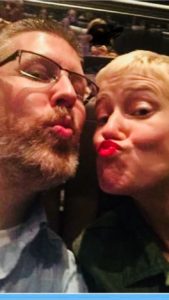 Man and woman puckered up with kissing faces