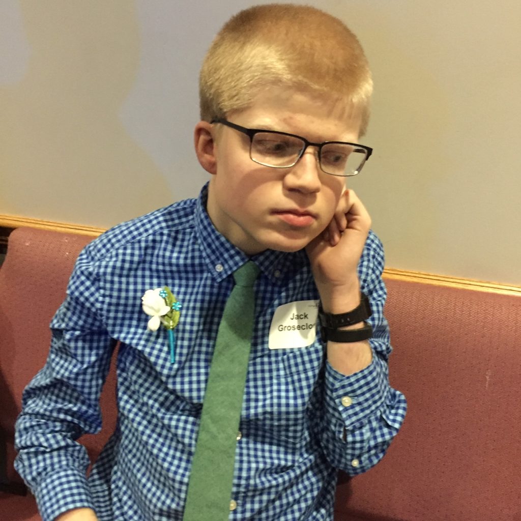 Teen with Smith-Kingsmore syndrome dressed and ready for Prom