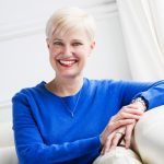 Smith-Kingsmore Syndrome Foundation Board President Kristen Groseclose in a chair